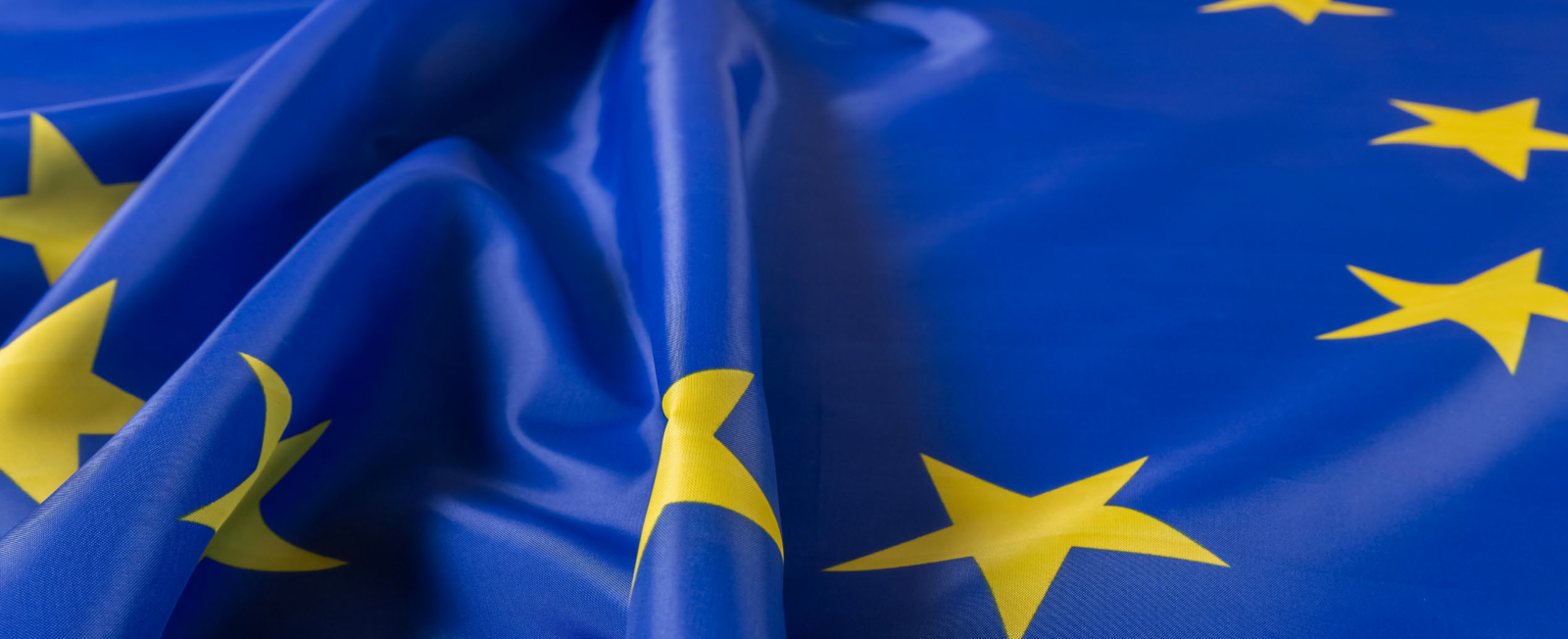Close-up of the European flag, blue with yellow stars