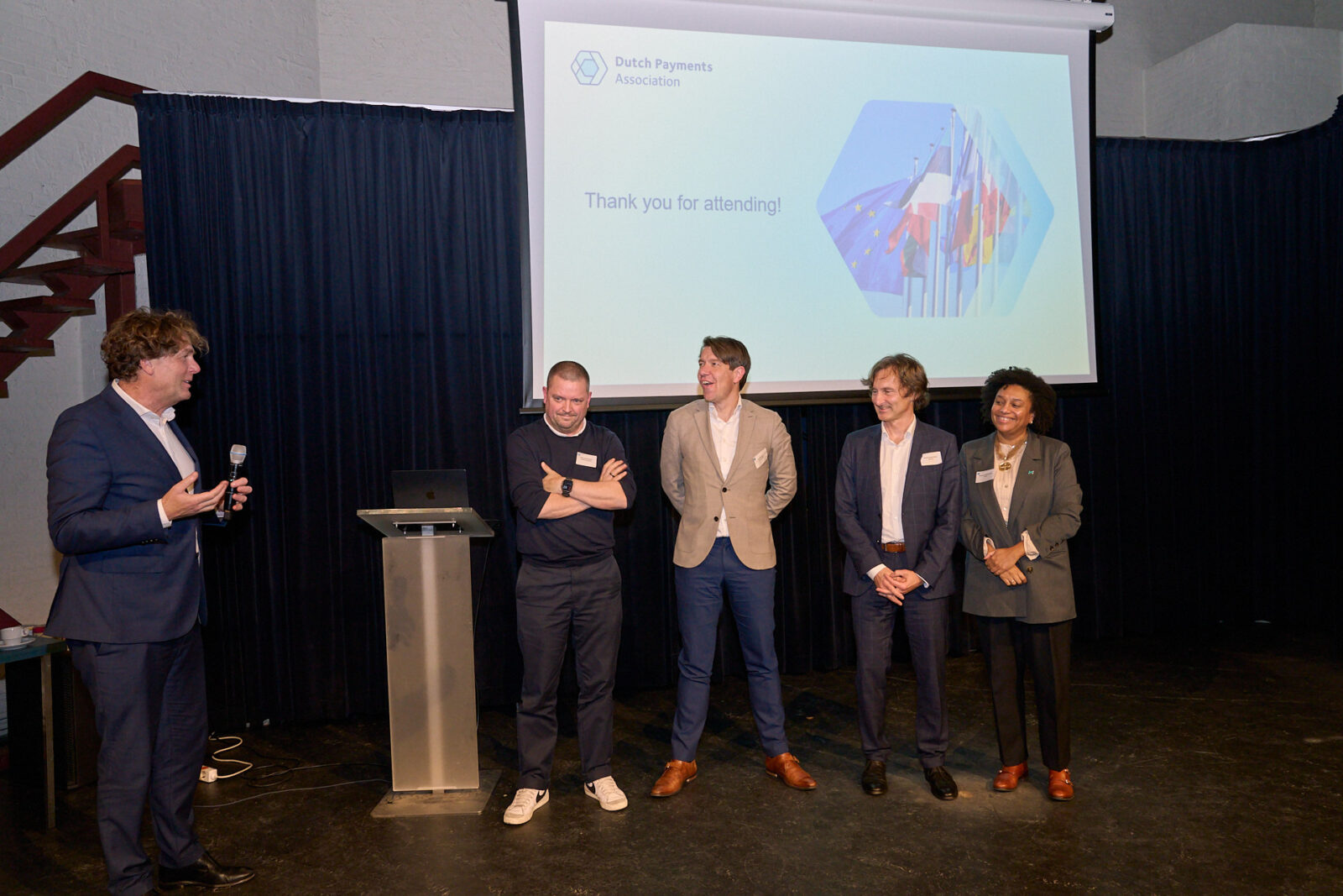 Managing Director Arjan Bol thanks the four speakers on stage during the 2025 Biannual Meeting