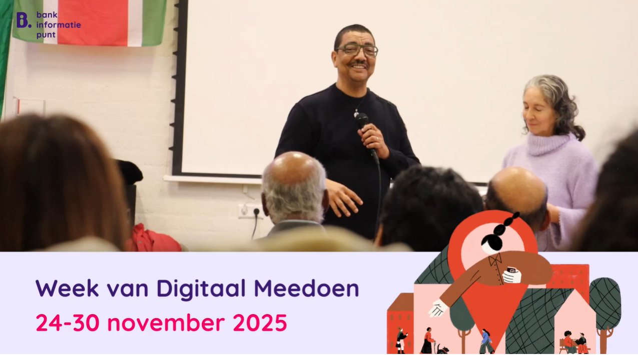 A screenshot from a video showing Jörgen Raymann, ambassador for the Accessible Banking Program, standing in front of a group of people and addressing them during Digital Inclusion Week; at the bottom of the screen is a banner reading: “Digital Inclusion Week November 14–30, 2025”